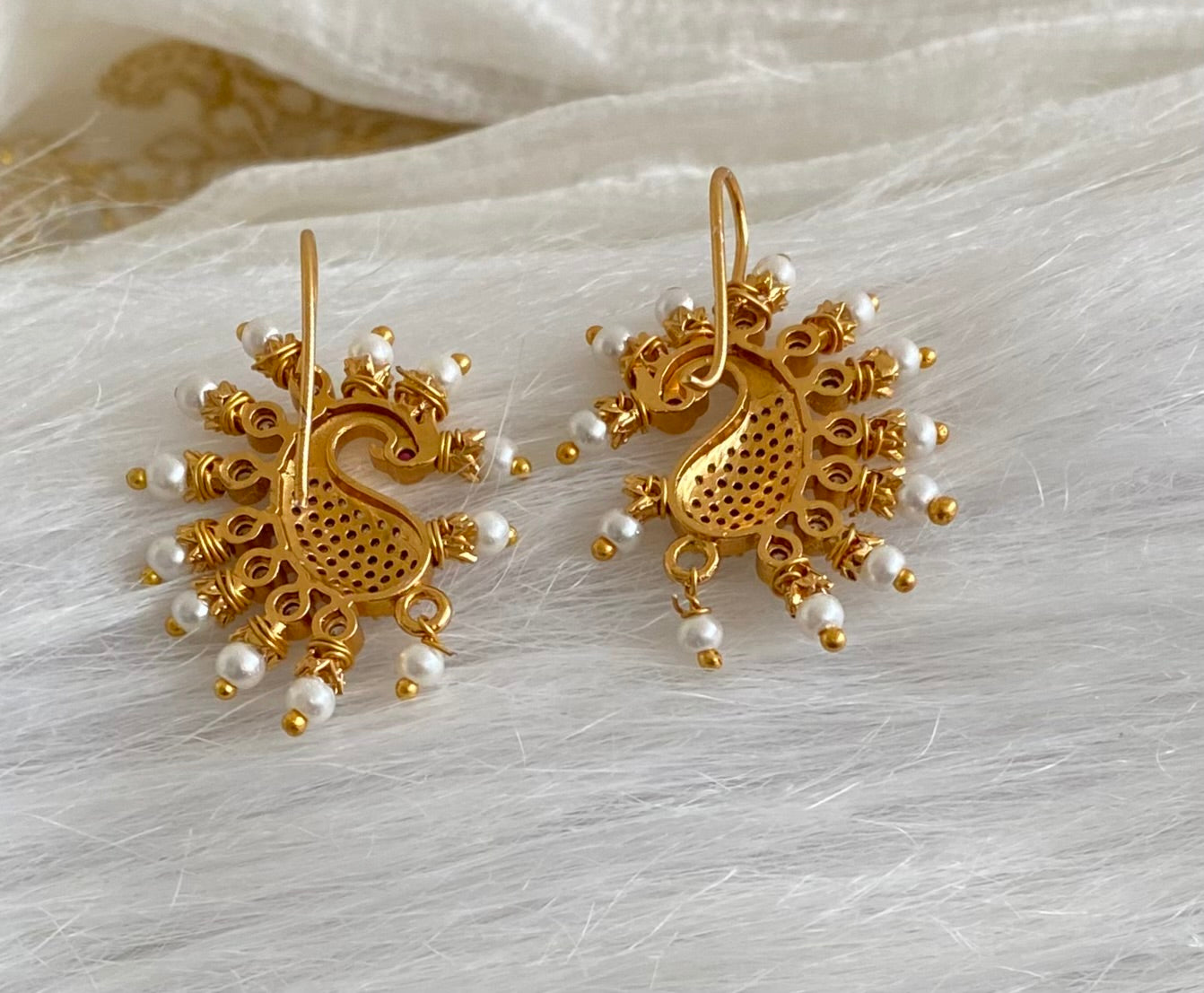 Matte gold white stone pearl peacock bugadi earrings dj-53670