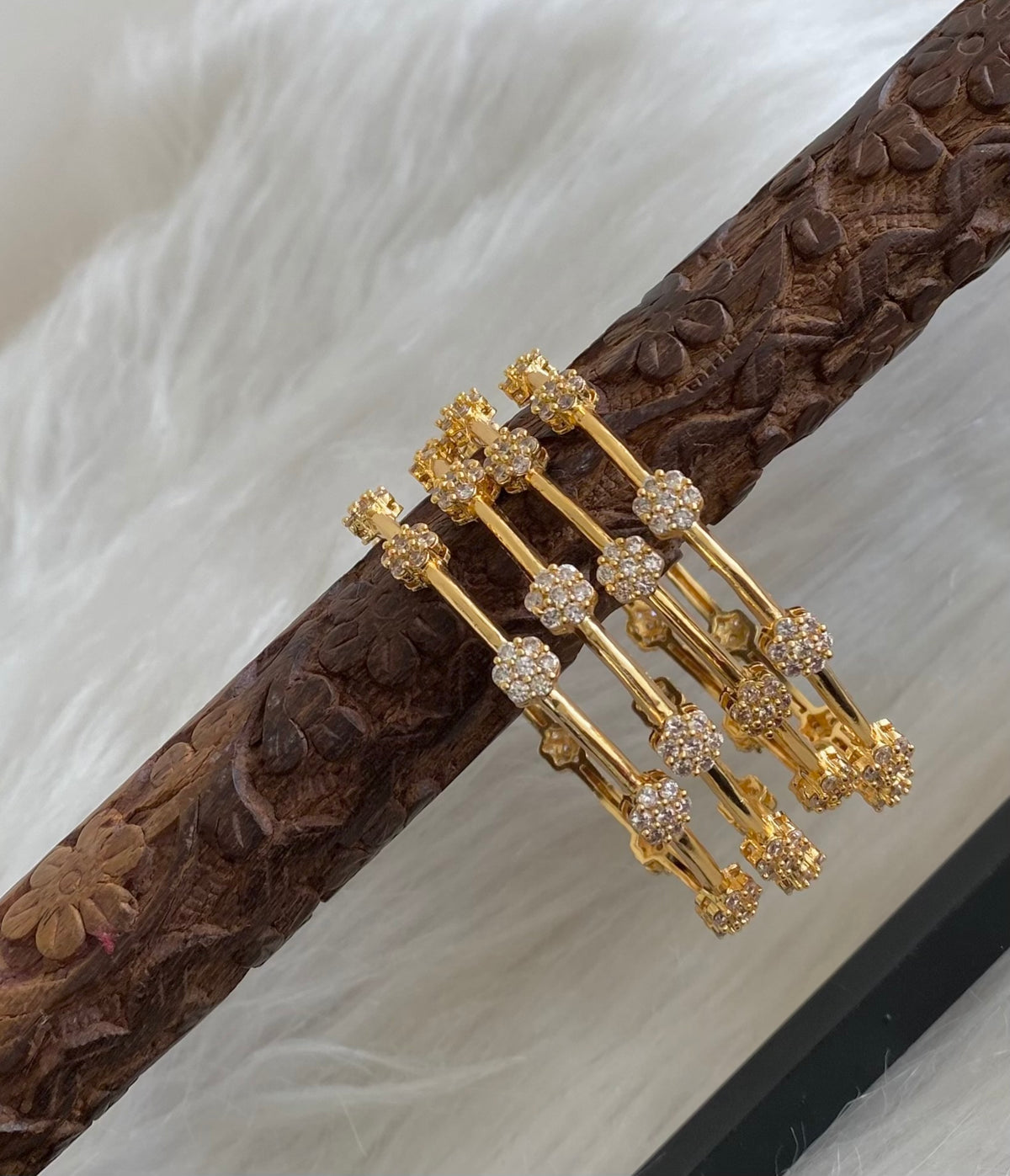 Gold tone white stone set of 4 bangles (2.6) dj-54824
