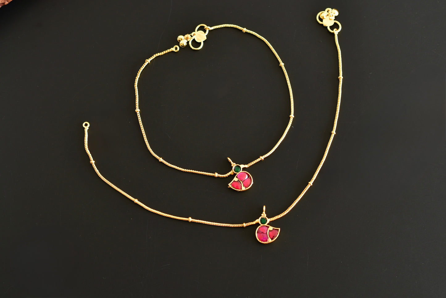 Gold tone pink-green bird kundan jadau anklets dj-52385