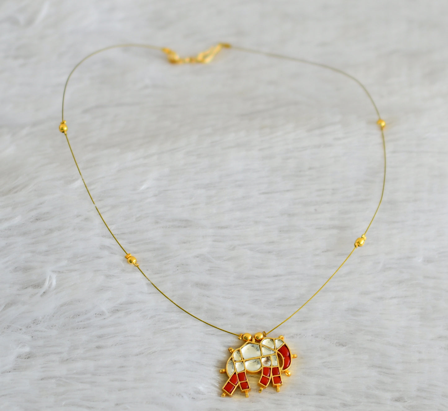 Gold tone coral-white kundan jadau elephant invisible necklace dj-48705