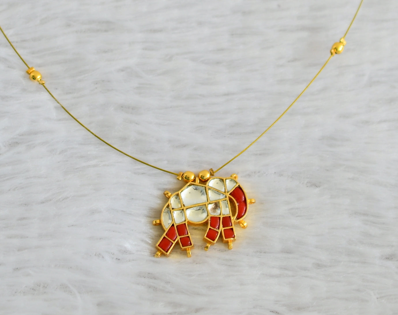 Gold tone coral-white kundan jadau elephant invisible necklace dj-48705