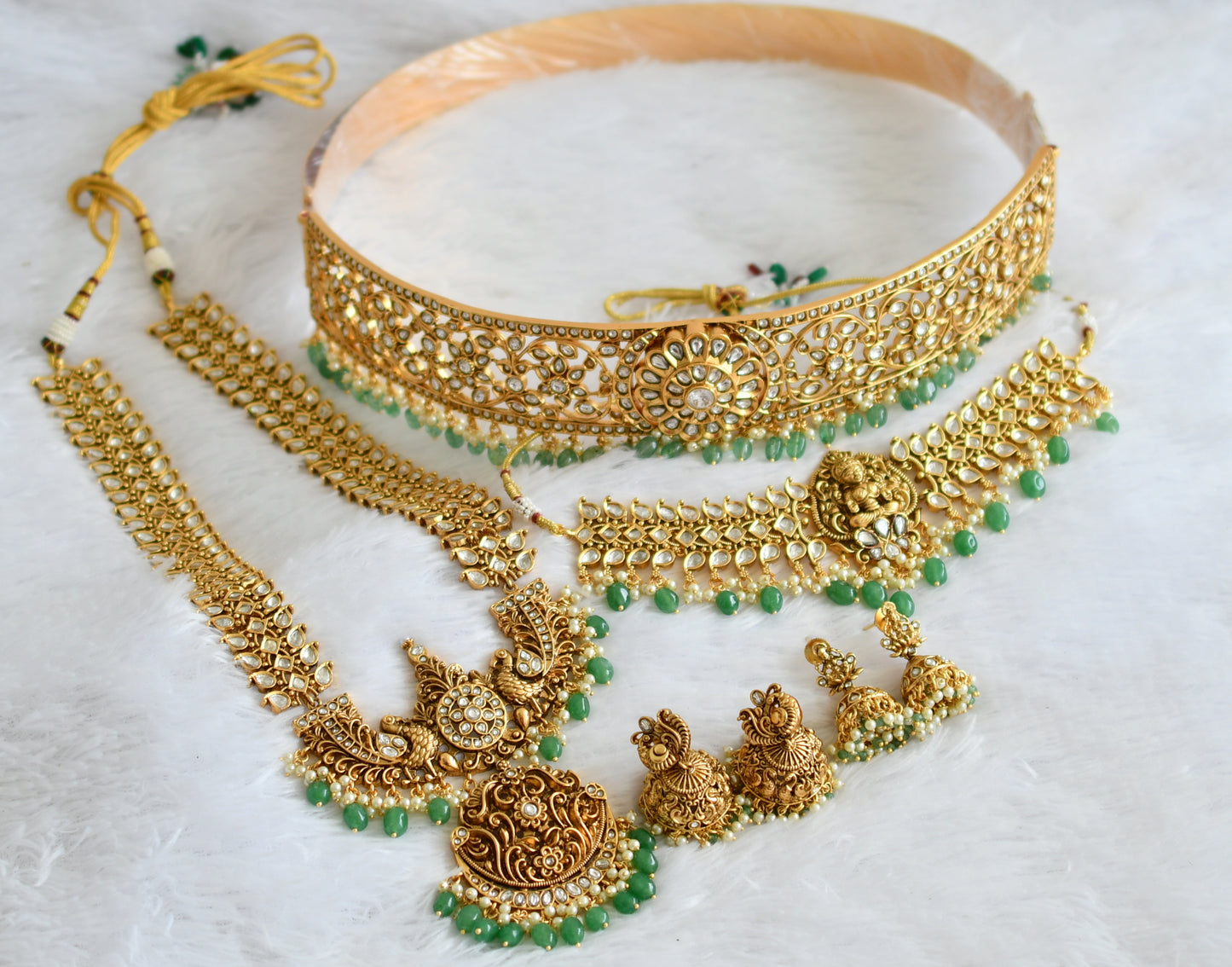 Matte finish white lakshmi-peacock-maango green beaded bridal set dj-50877