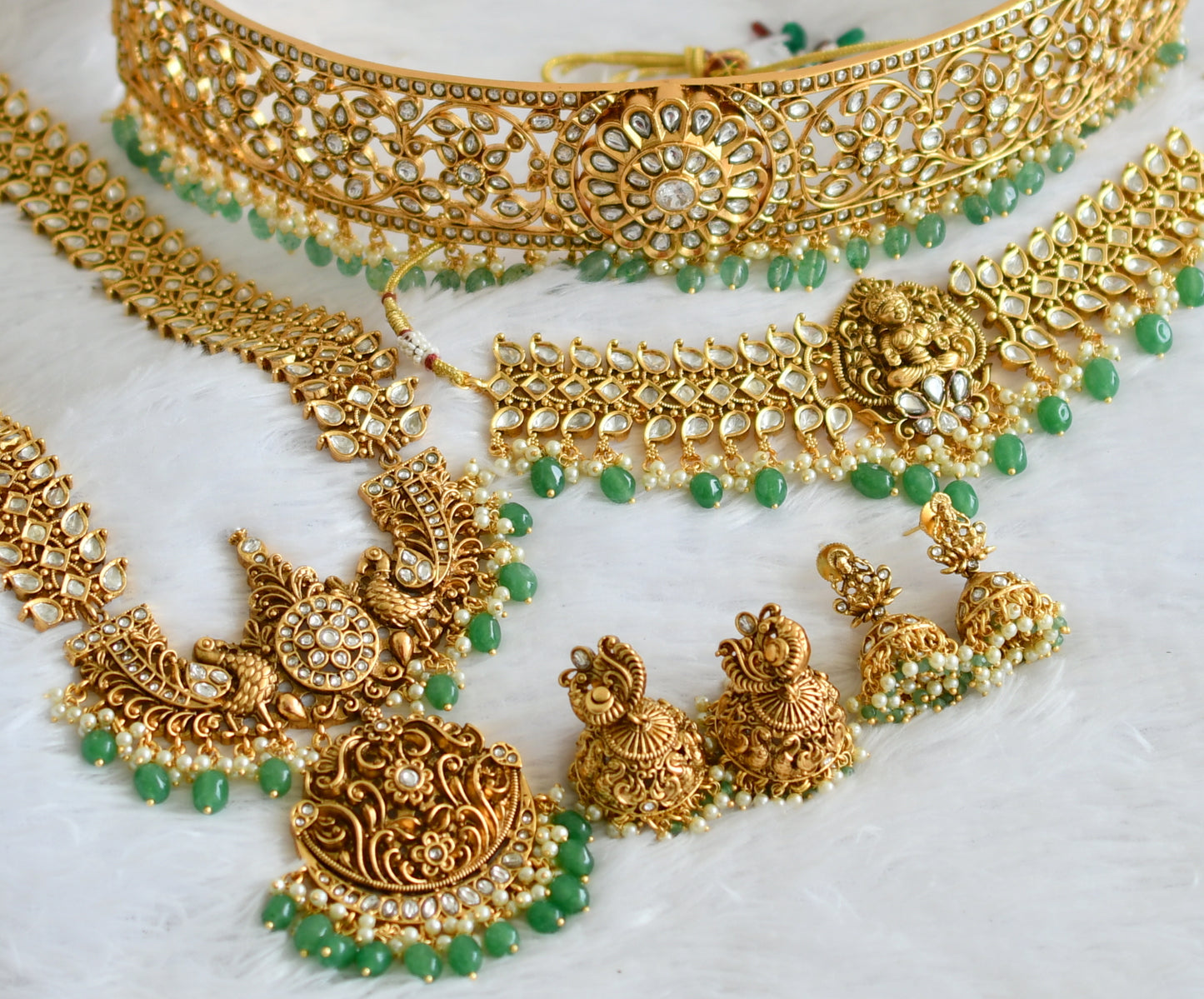 Matte finish white lakshmi-peacock-maango green beaded bridal set dj-50877
