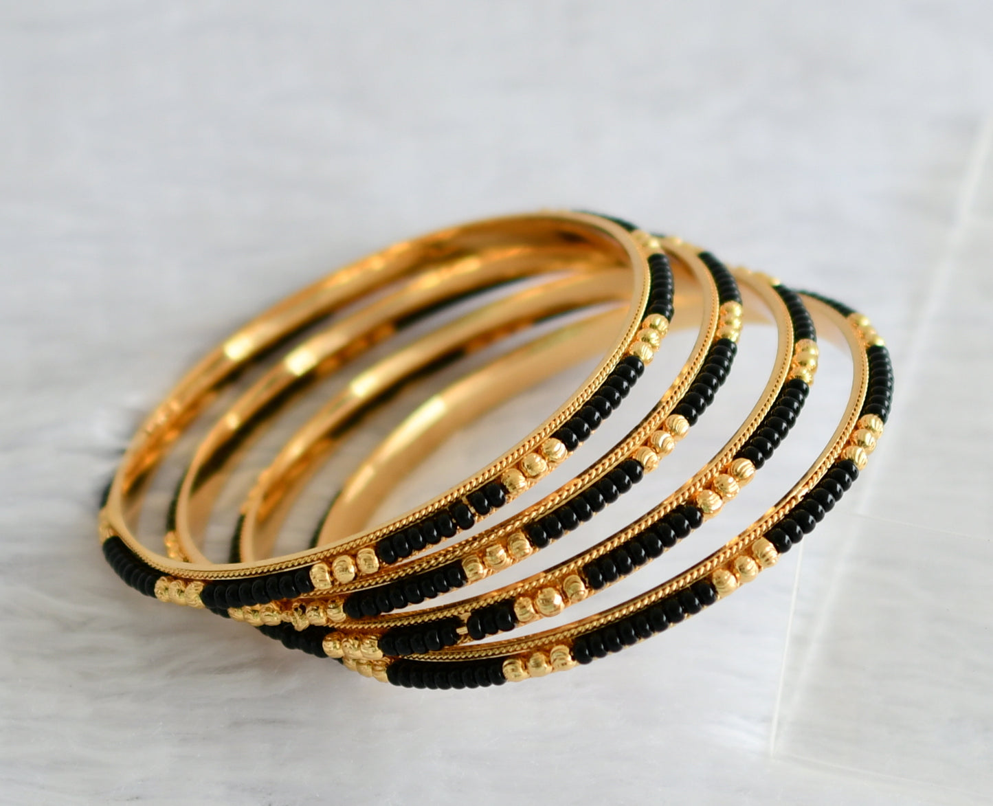 Gold tone karimani set of 4 bangles(2.4) dj-50969