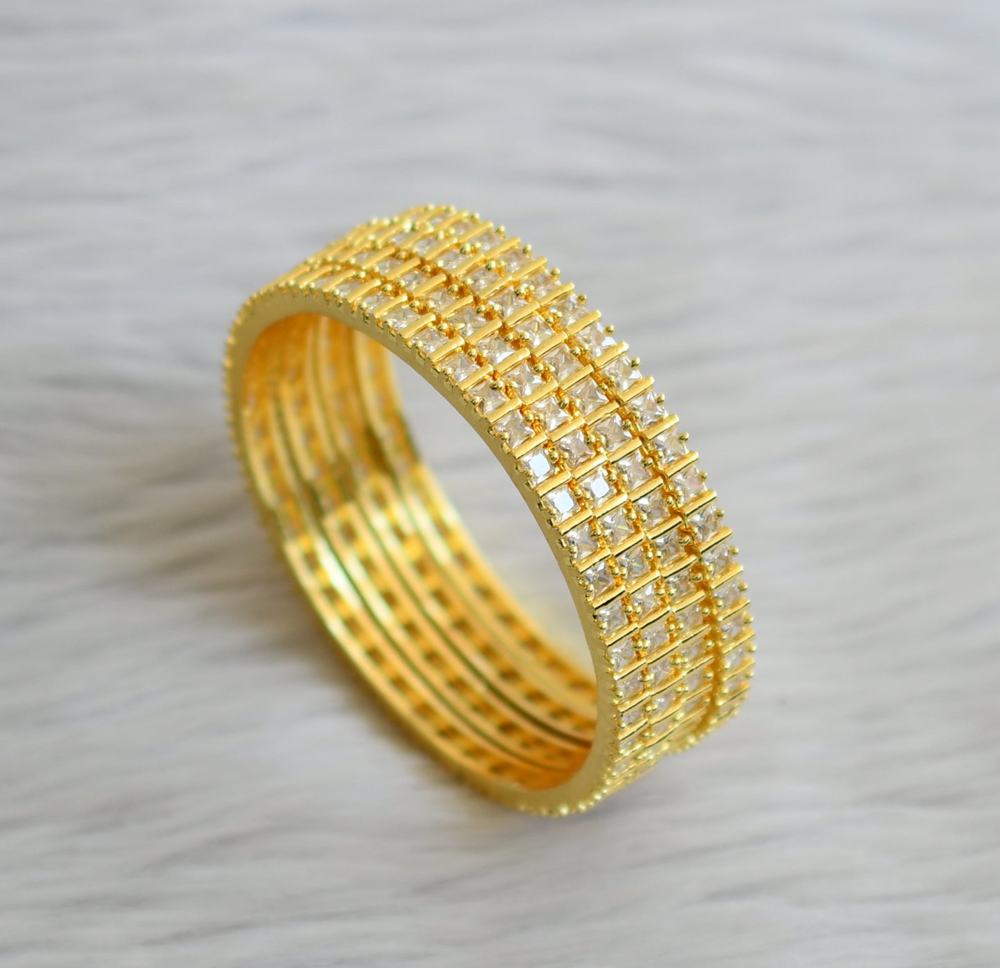 Gold tone cz white square stone set of 4 bangles(2.10) dj-45626