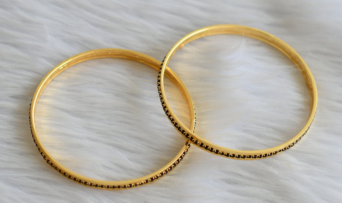 Gold tone black stone bangles(2.4) dj-43989