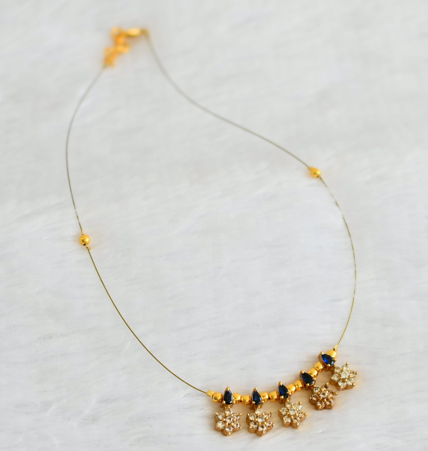 Gold tone cz blue flower invisible necklace dj-49266 – dreamjwell