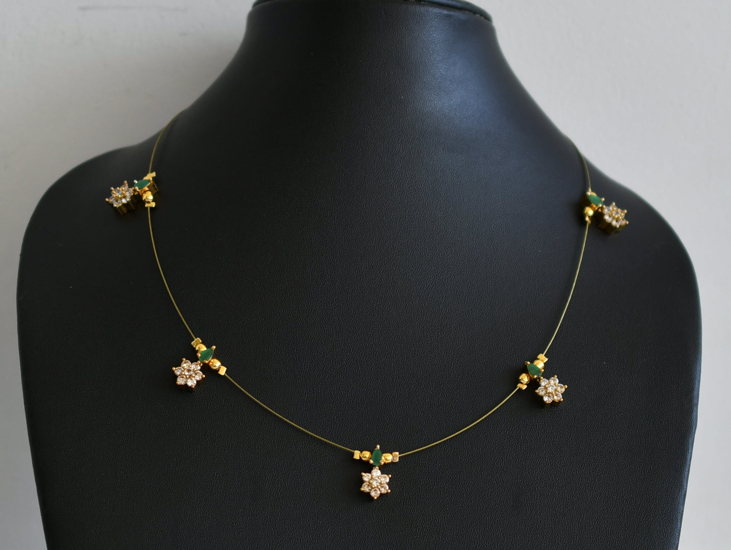 Gold tone cz emerald flower invisible necklace dj-49270