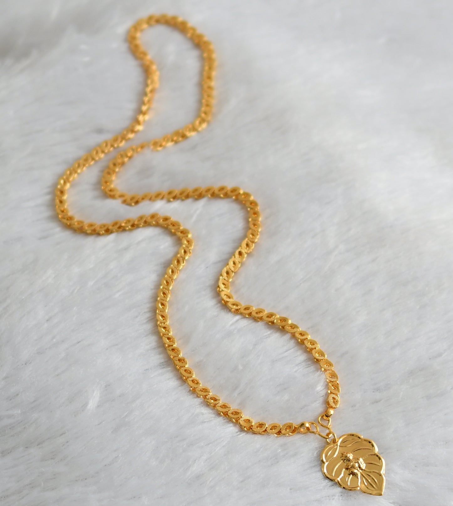 Gold tone 24 inches chain with krishna leaf pendant dj-47461