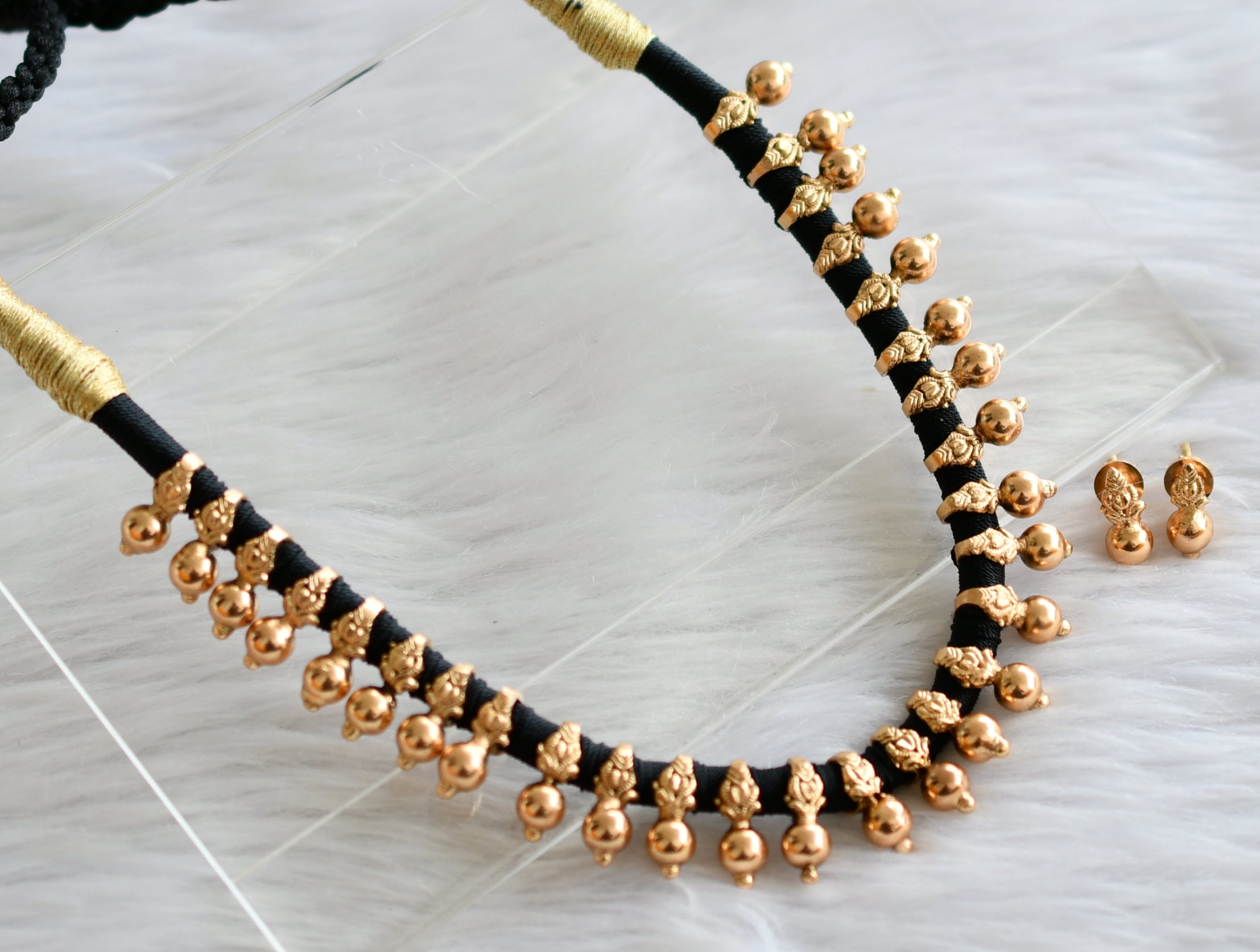 Black thread deals gold jewellery online