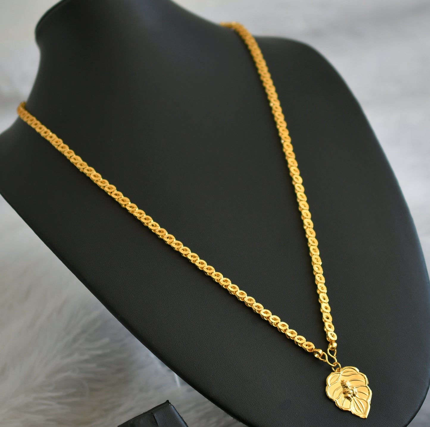 Gold tone 24 inches chain with krishna leaf pendant dj-47461