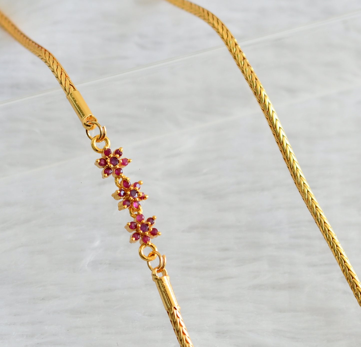 Gold tone ruby stone flower mugappu chain dj-47585