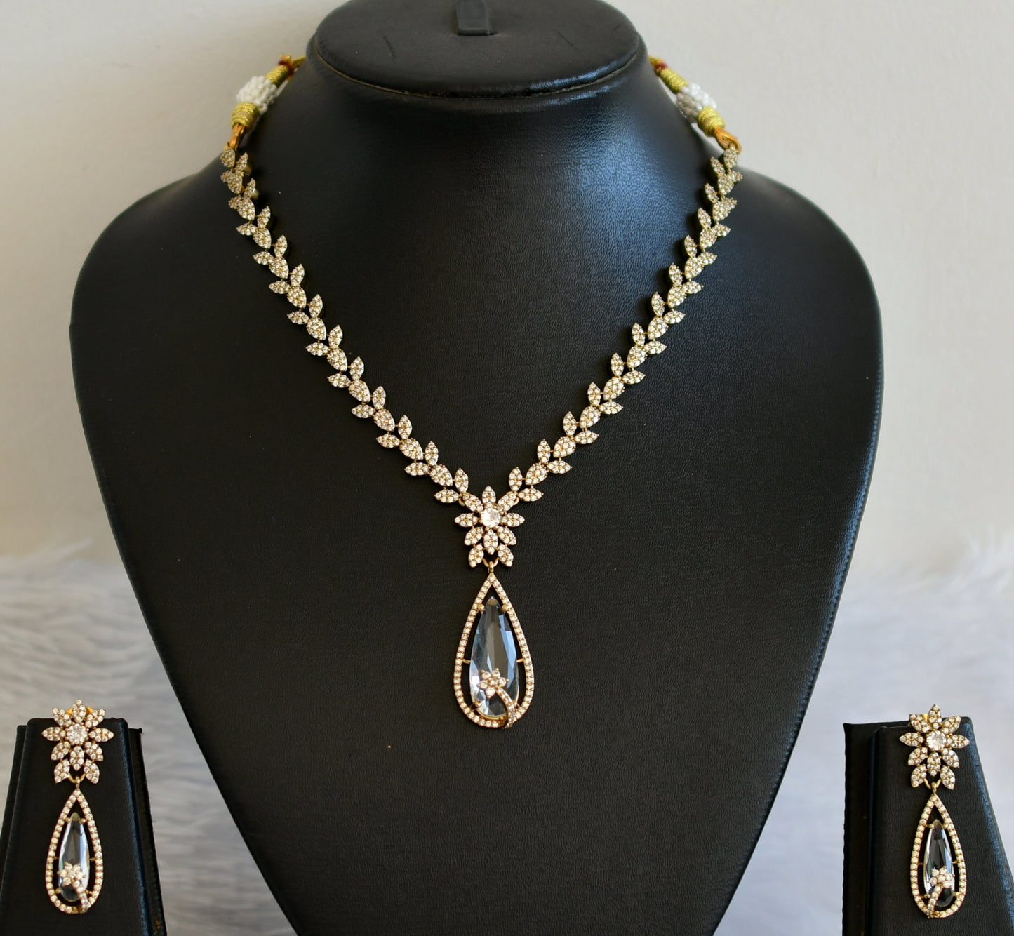 Antique cz white thilak stone leaf necklace set dj-49429