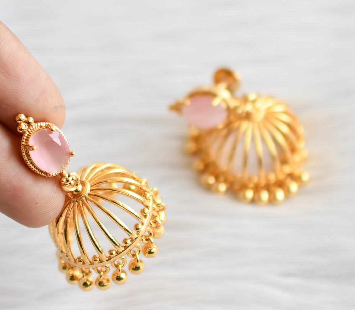 Gold tone baby pink oval stone jhumkka dj-44291