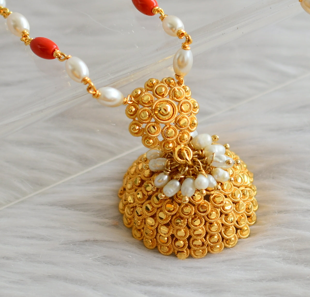 Gold tone flower jhumkka pendant with coral-pearl chain dj-44417