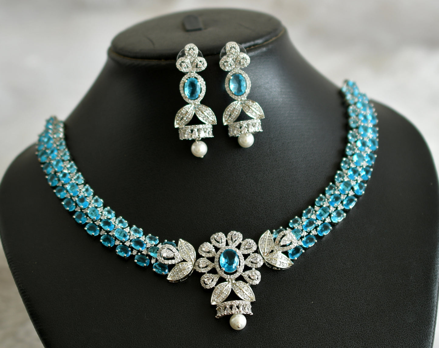 Silver tone cz sky blue-white oval stone flower necklace set dj-47862