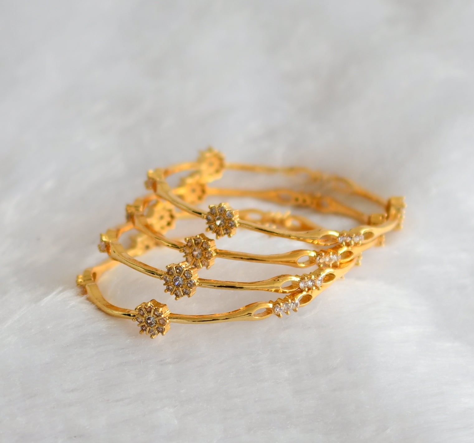 Gold tone cz white flower set of 4 bangles(2.4) dj-46284 – dreamjwell
