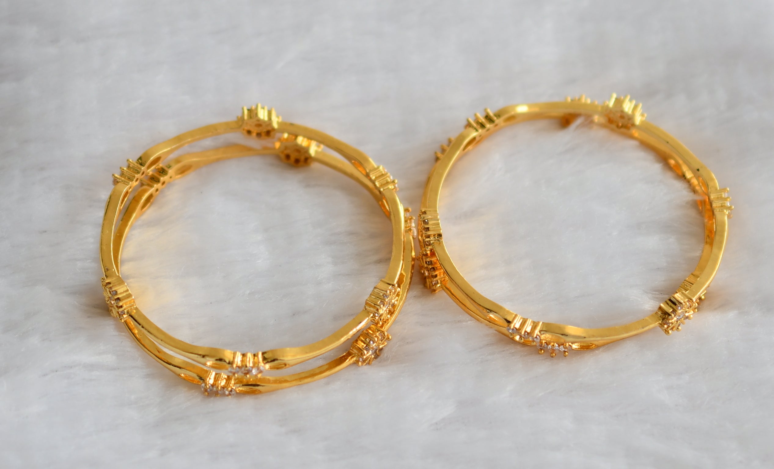 Gold tone cz white flower set of 4 bangles(2.4) dj-46284 – dreamjwell