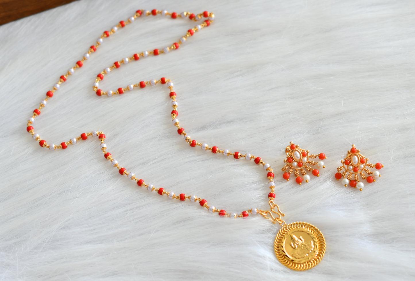 Gold tone pearl-coral chain with Lakshmi pendant and earrings dj-43006