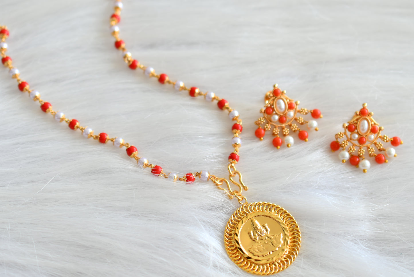 Gold tone pearl-coral chain with Lakshmi pendant and earrings dj-43006