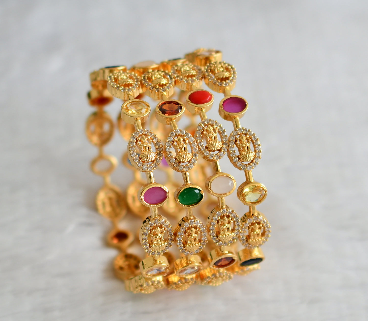 Gold tone cz-navarathna oval stone lakshmi set of 4 bangles(2.4) dj-49963
