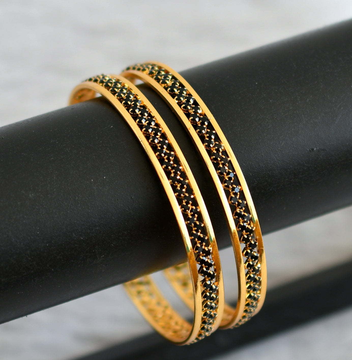 Gold tone black stone bangles(2.6) dj-48052