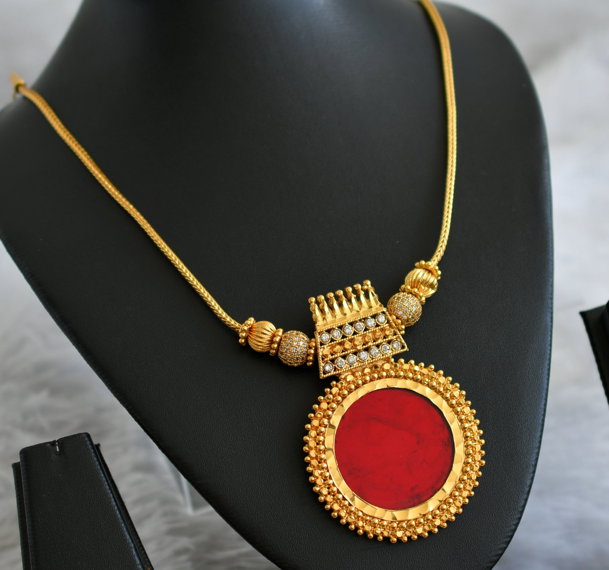 Gold Tone Pebsant 1” shops with red cooor stone.