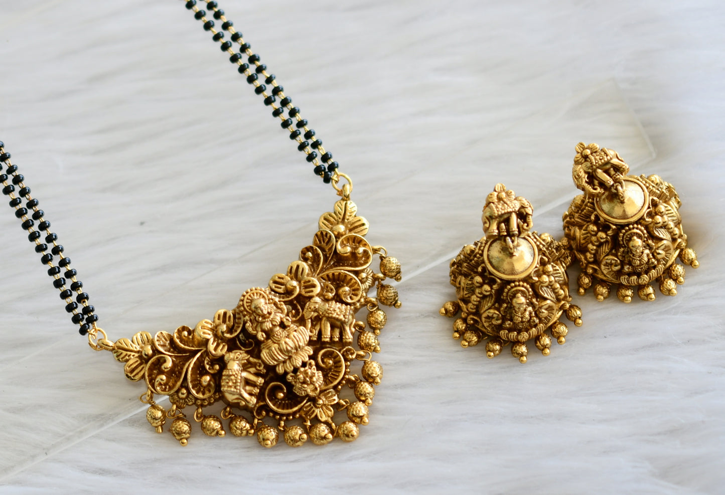 Antique gold tone 24 inches karimani mangalsutra with lakshmi-elephant pendant set dj-44819