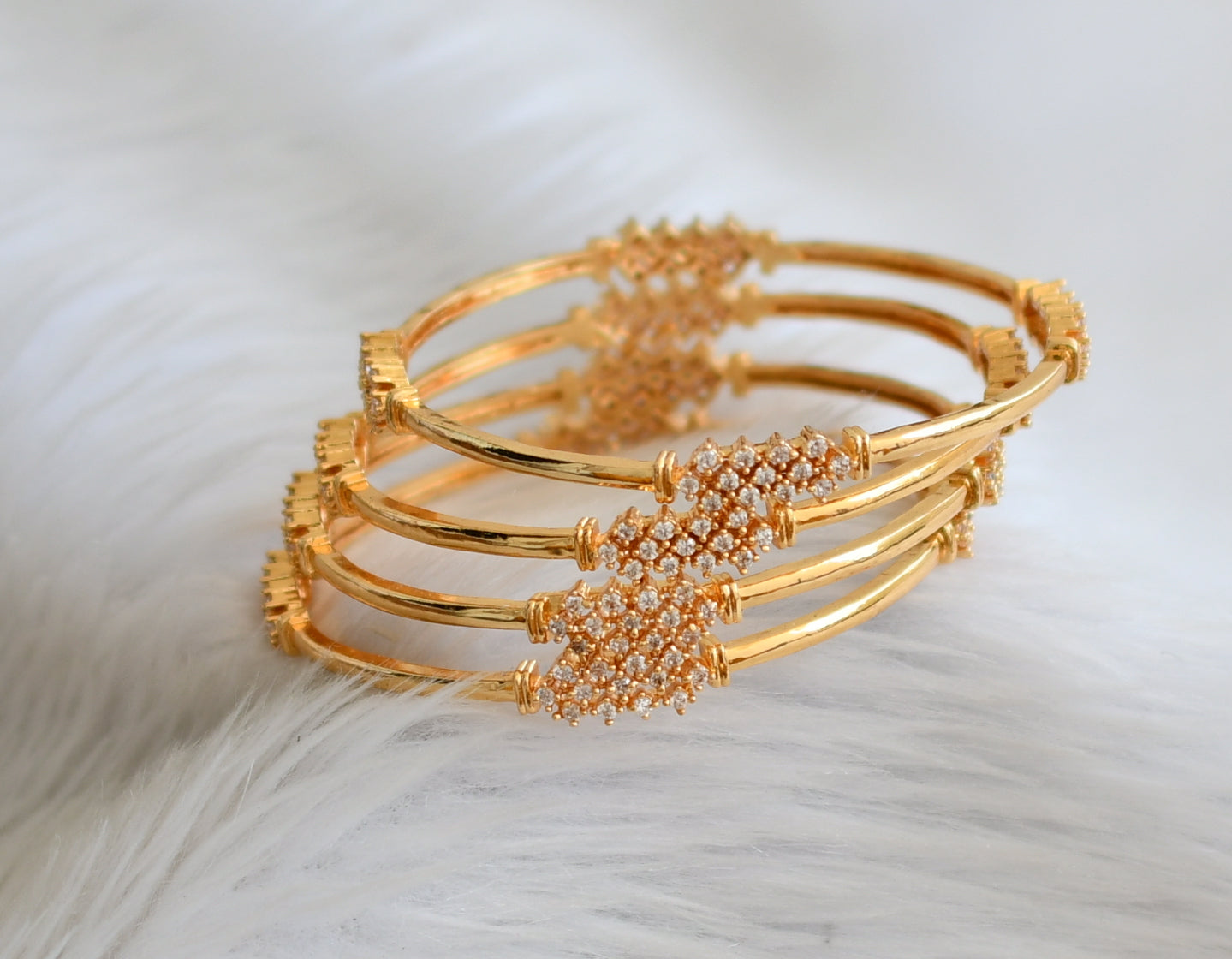Gold tone cz white set of 4 bangles(2.8) dj-45147