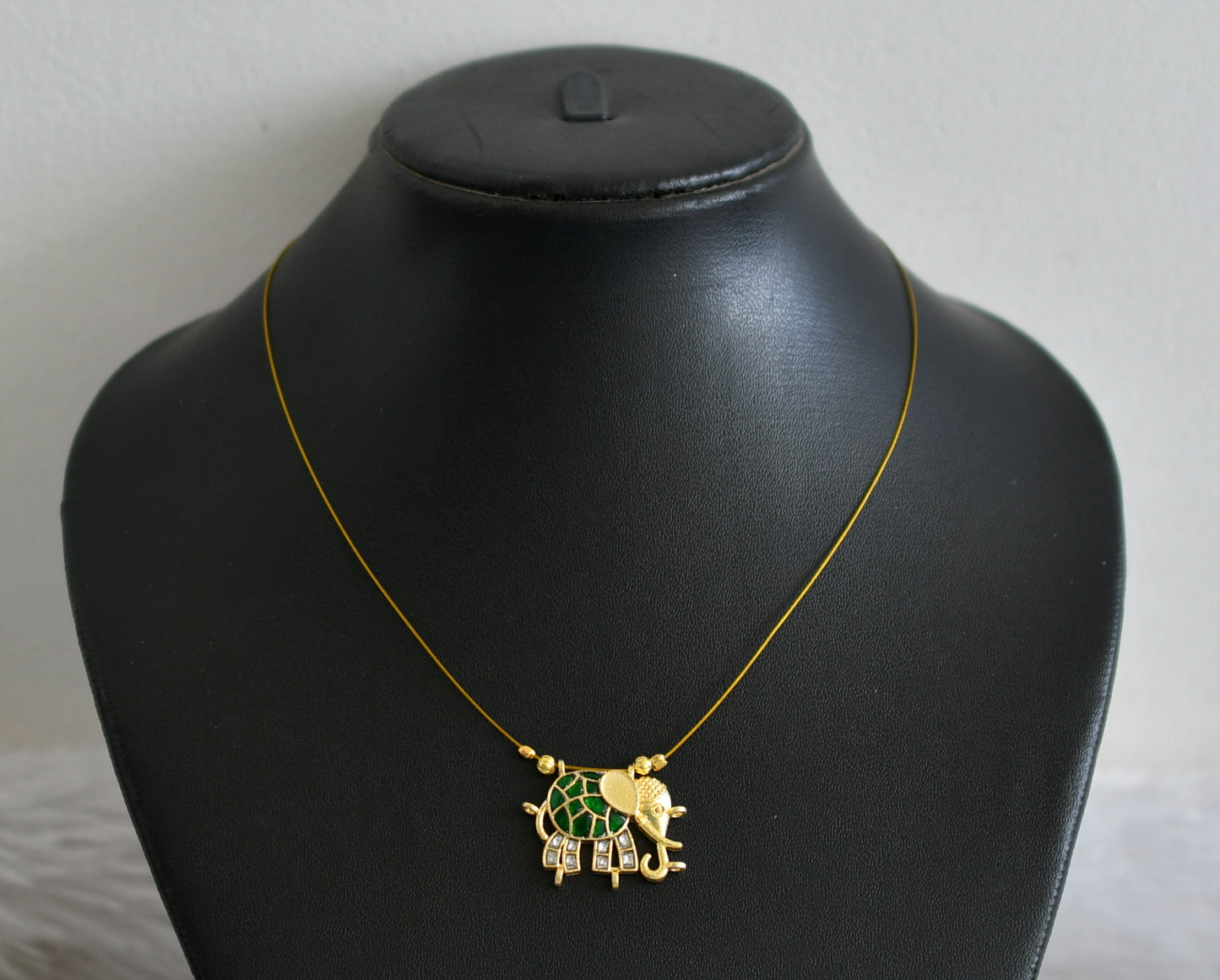 Gold tone green-white kundan jadau elephant invisible necklace dj-48713