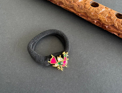 Gold tone pink-green-white kundan jadau peacock hair band dj-51487