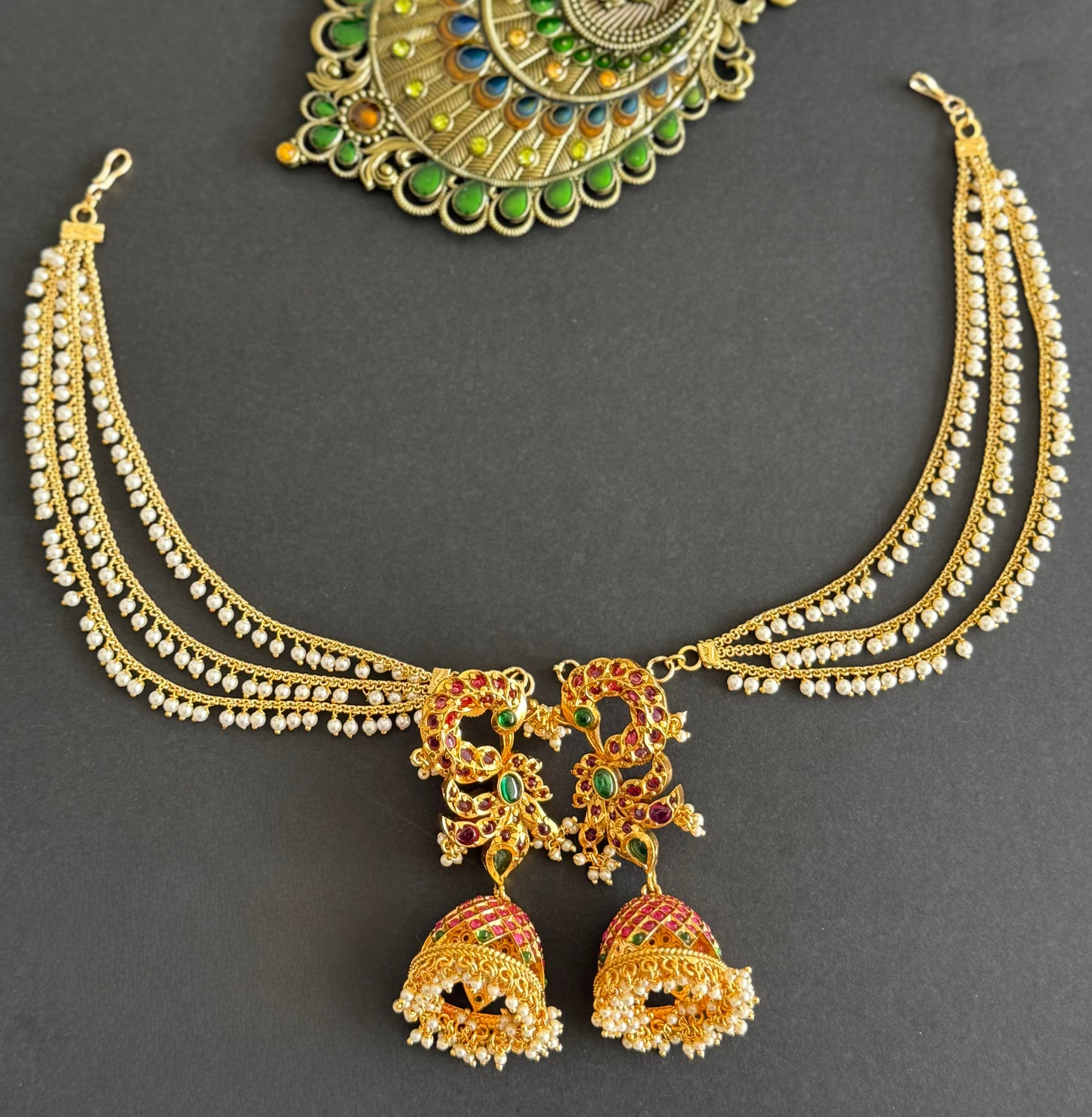 Matte finish kemp-green peacock jhumkka with pearl multilayer ear side chain dj-51492