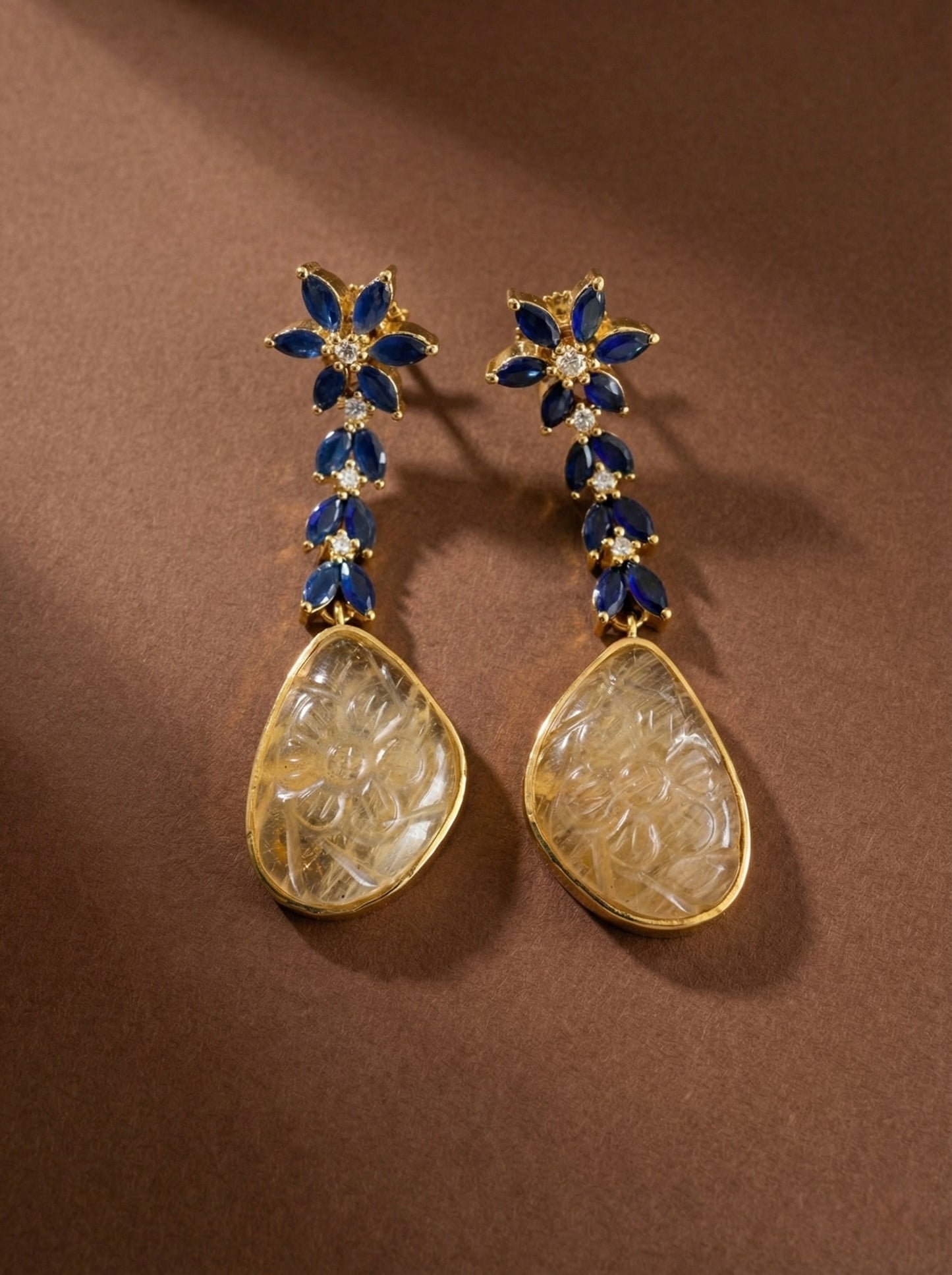 Gold tone blue-cream carved stone earrings-dj52592