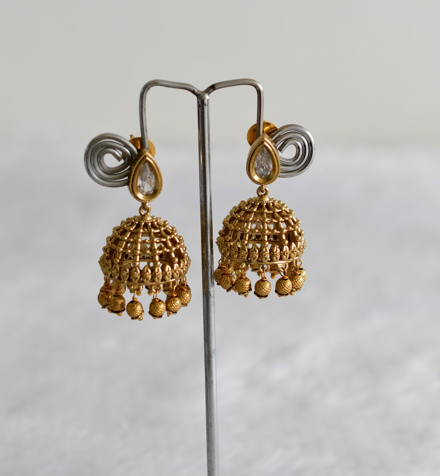 Antique gold tone white thilak stone pearl jhumkka dj-51852