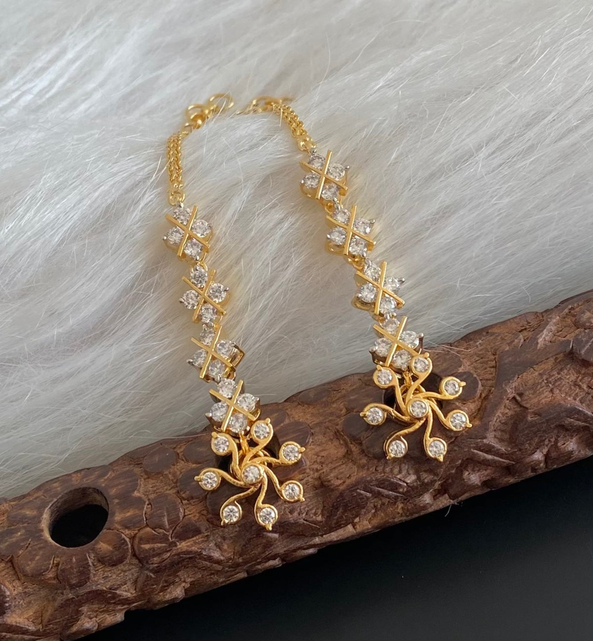 Gold tone white stone earrings with ear side chain dj-55059
