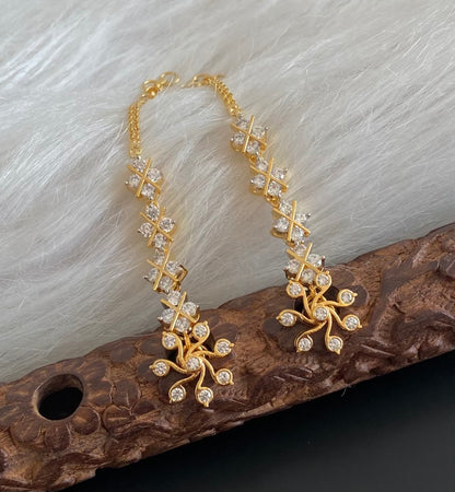 Gold tone white stone earrings with ear side chain dj-55059