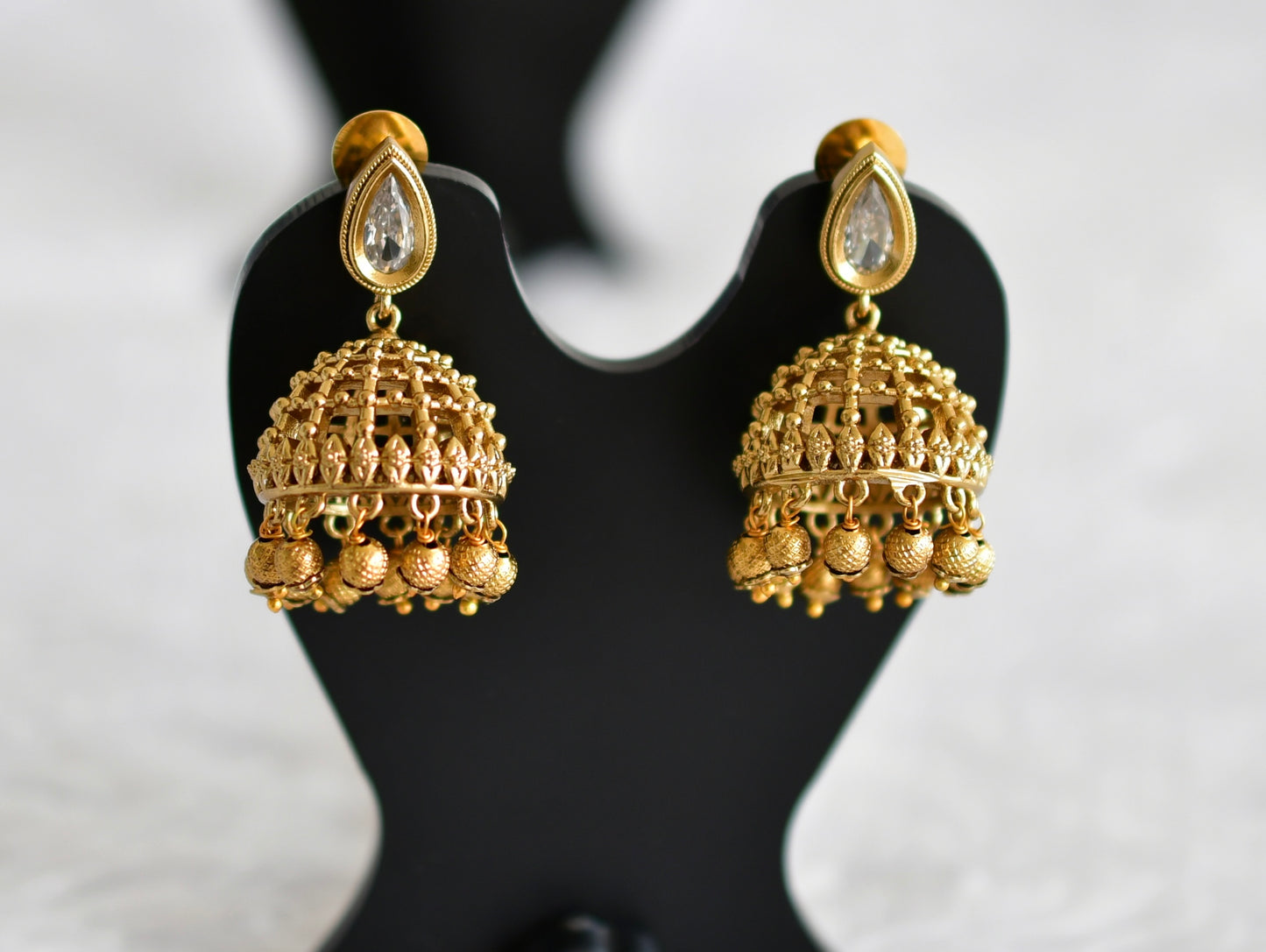 Antique gold tone white thilak stone pearl jhumkka dj-51852