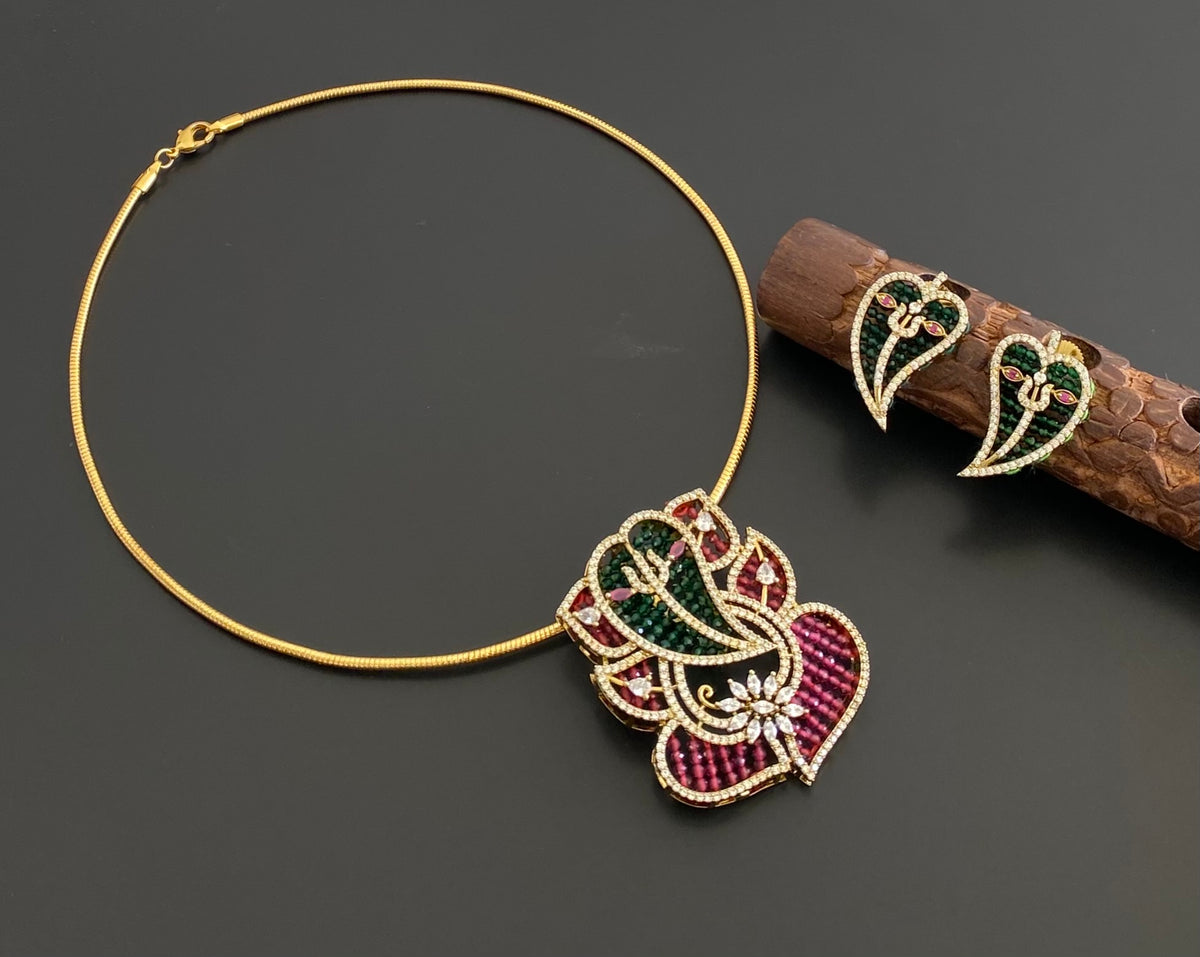 Antique gold tone cz white stone ruby-green beaded ganesha pendant set with kanti necklace dj-55121