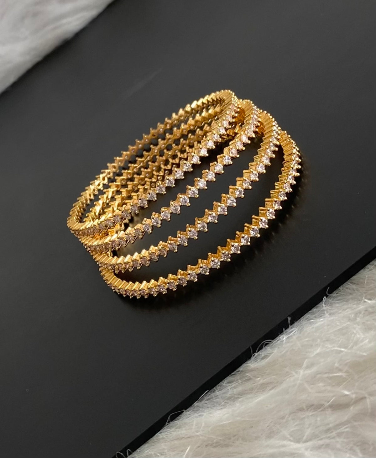Gold tone white stone set of 4 bangles (2.6) dj-54827