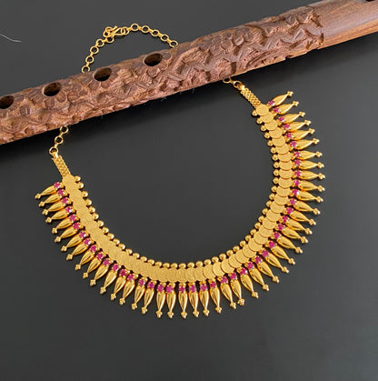 Gold tone kerala style pink stone lakshmi coin necklace dj-54136