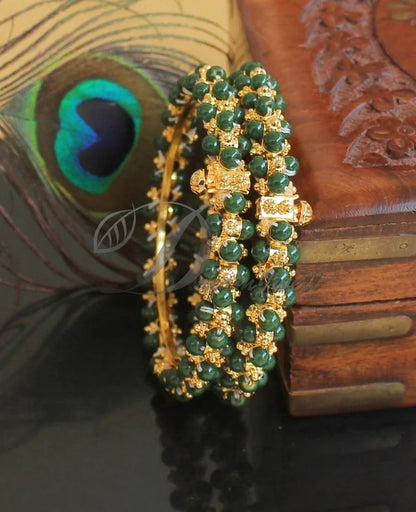 Gold tone green beaded bangles(2.10) dj-48527