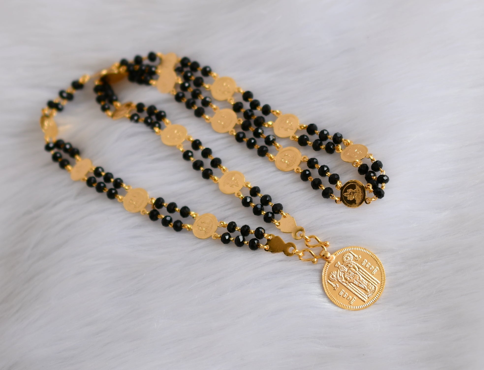 Lakshmi pendant deals with black beads