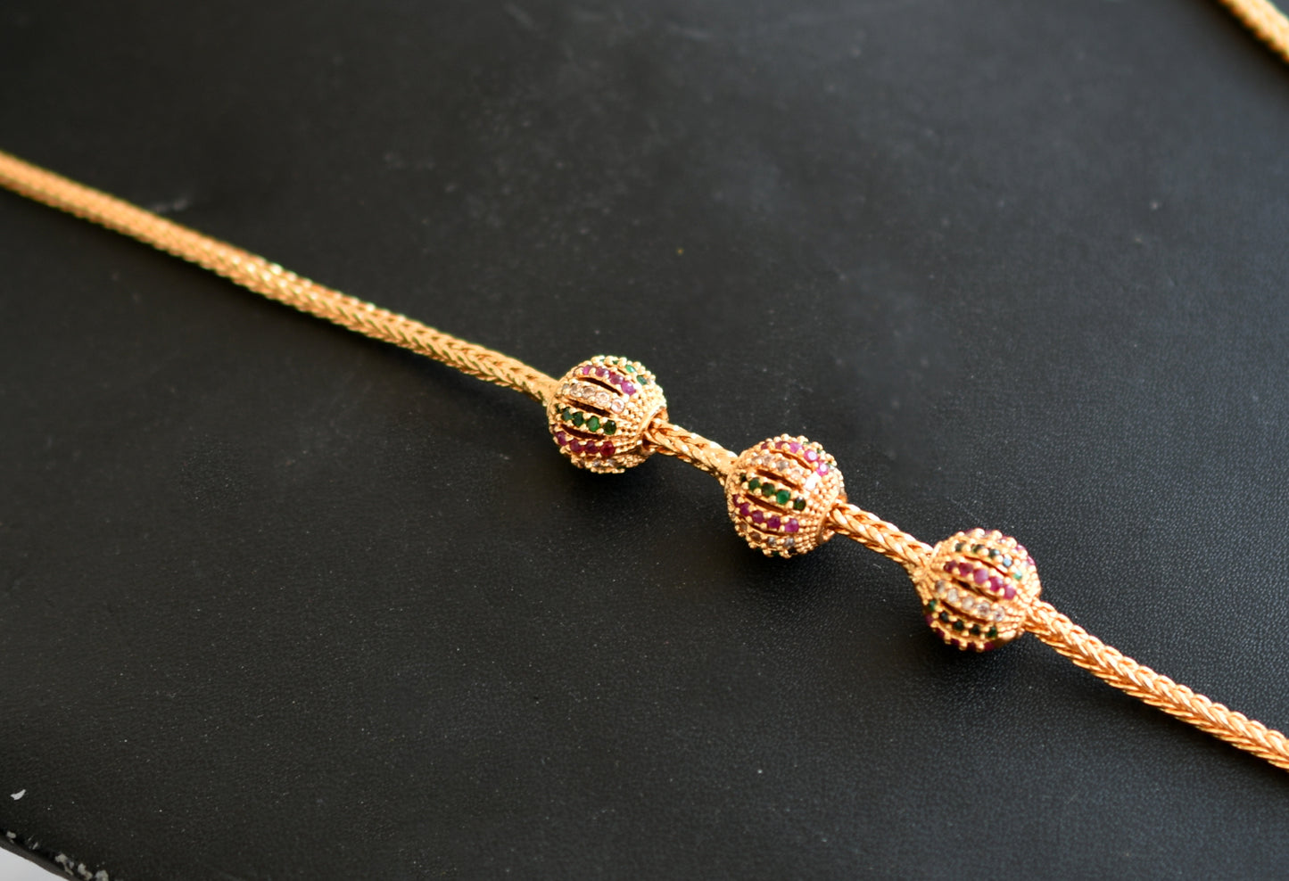 Gold tone ruby-white-green ball mugappu chain dj-40134