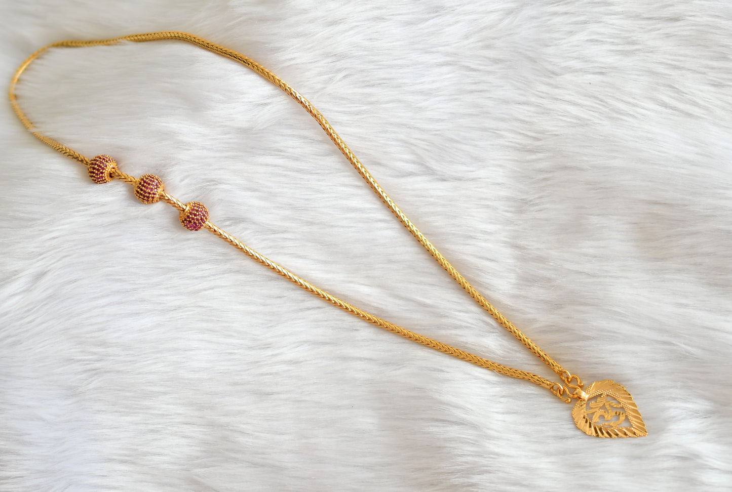 Gold tone ruby om pendant with mugappu chain dj-39635