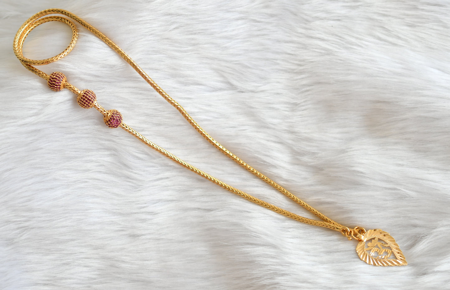 Gold tone ruby om pendant with mugappu chain dj-39635