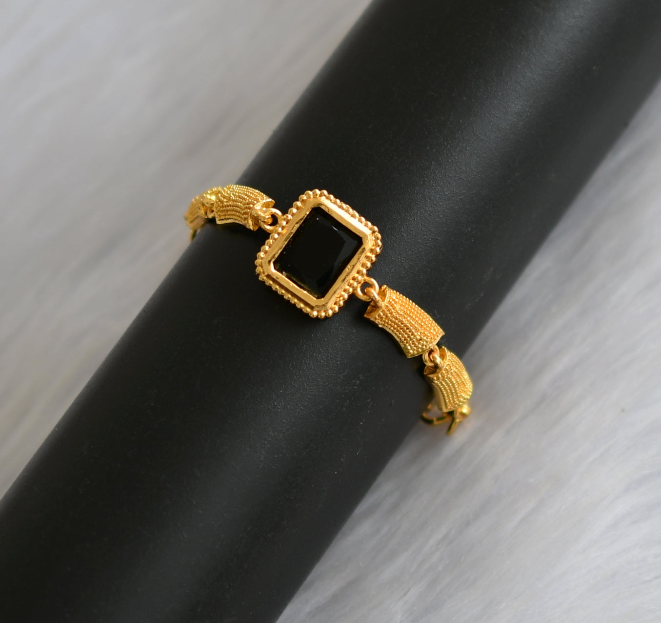 Gold tone black block stone bracelet dj-40491