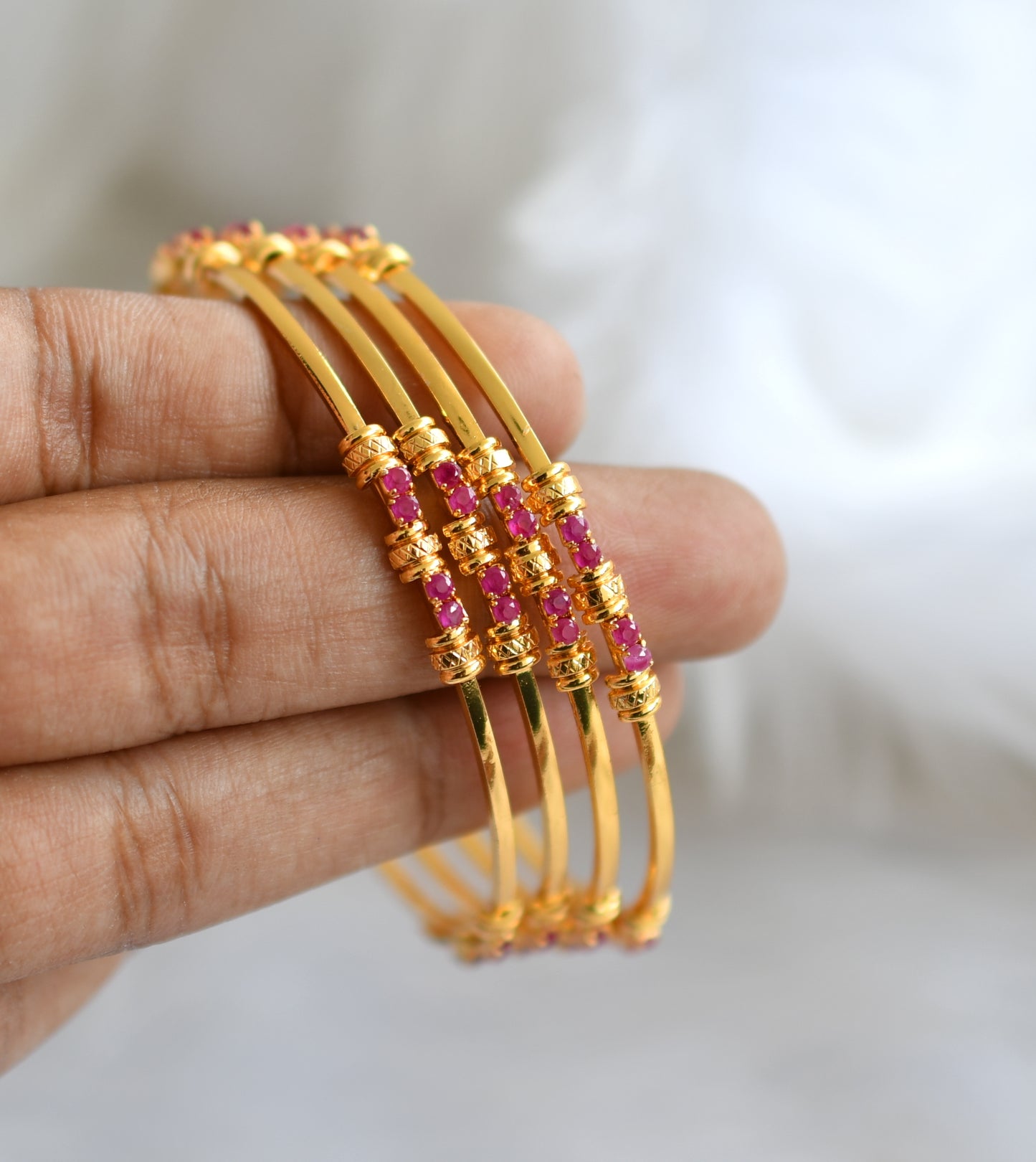 Gold tone ruby set of 4 bangles (2.4) dj-39066