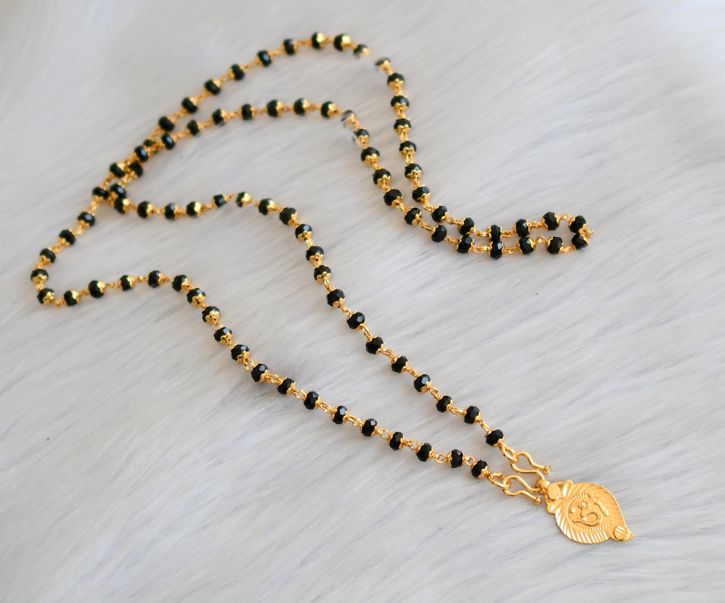 Gold tone black/karimani chain with 'om' Pendant dj-41901