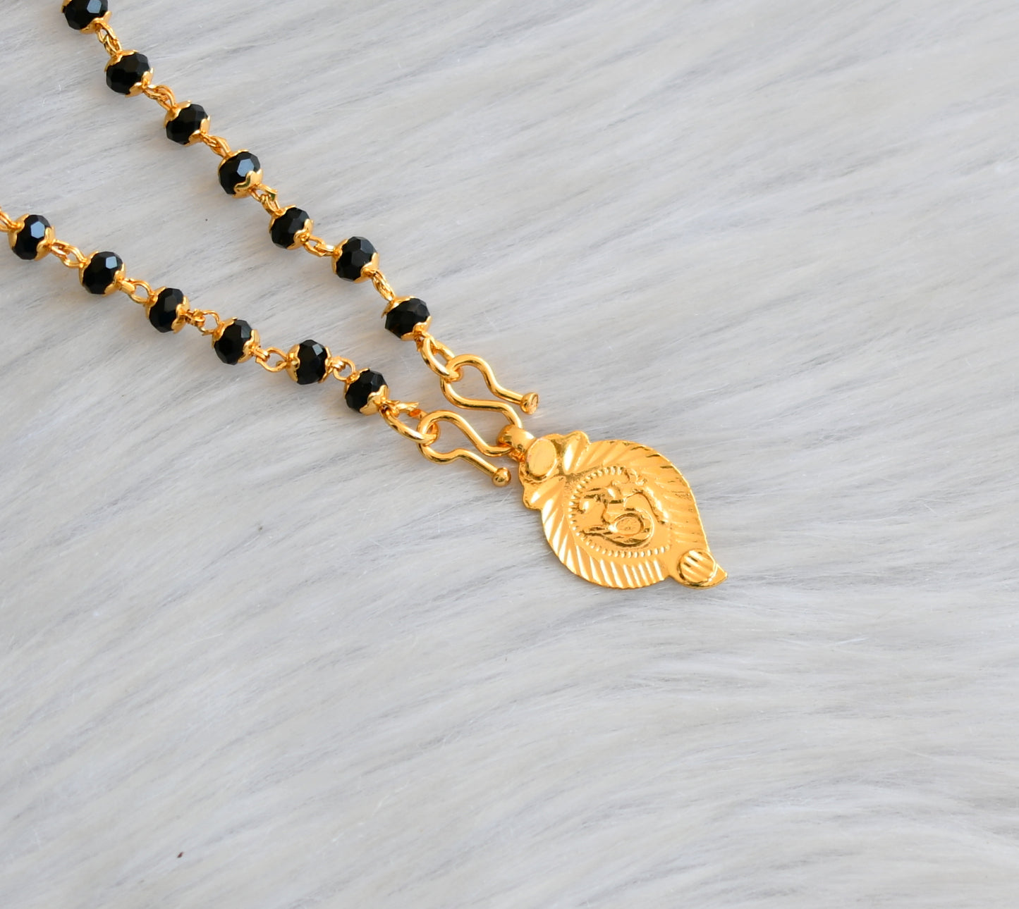 Gold tone black/karimani chain with 'om' Pendant dj-41901