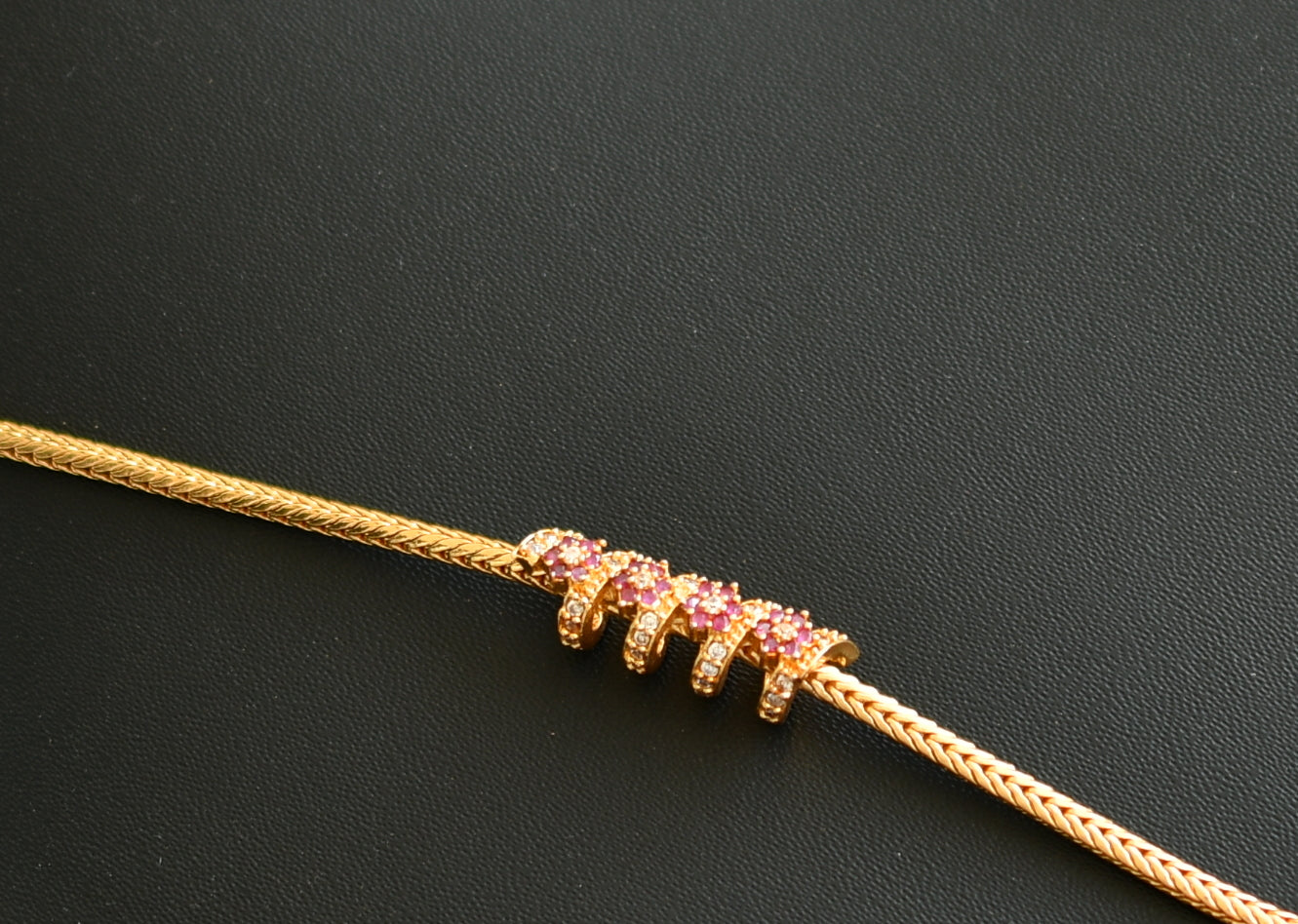 Gold tone ruby-white spiral mugappu chain dj-41958